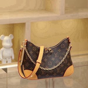 Odeon Small Handbag, featuring Monogram canvas and reinforced leather trim for a vintage-inspired look. An adjustable strap allows for shoulder or crossbody carry, while a smooth zipper opening provides easy access to essentials. Dimensions: 27.0 x 16.0 x 10.0 cm